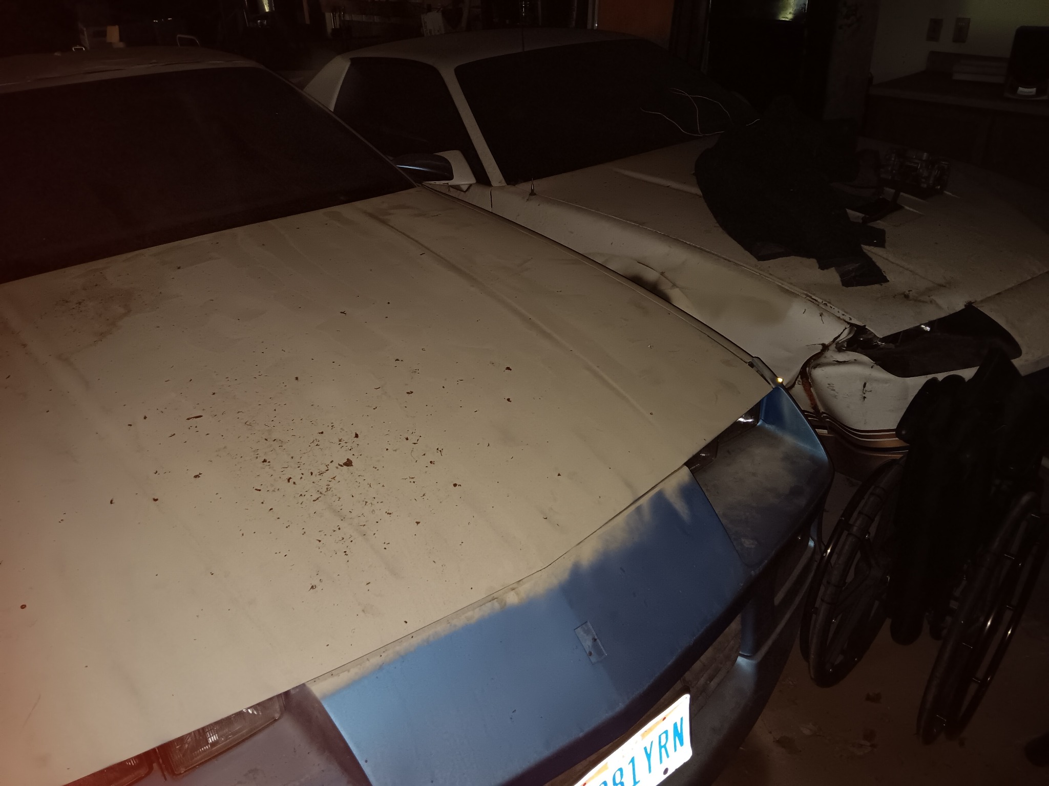 Two Camaros stored together