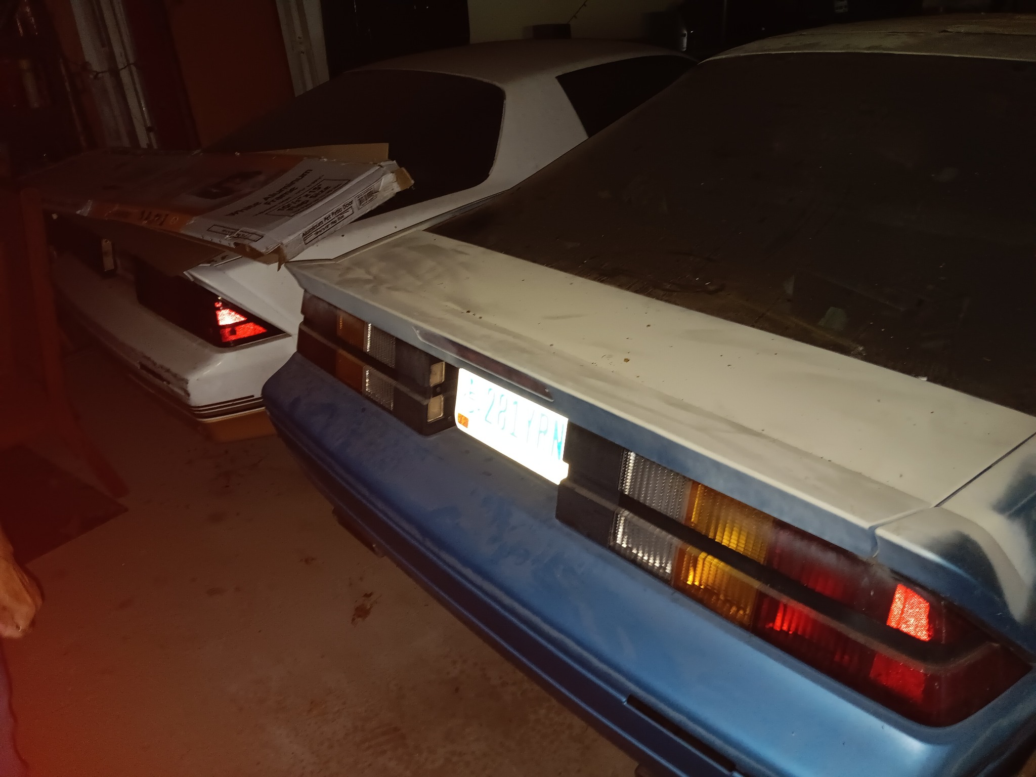 Rear view of both Camaros